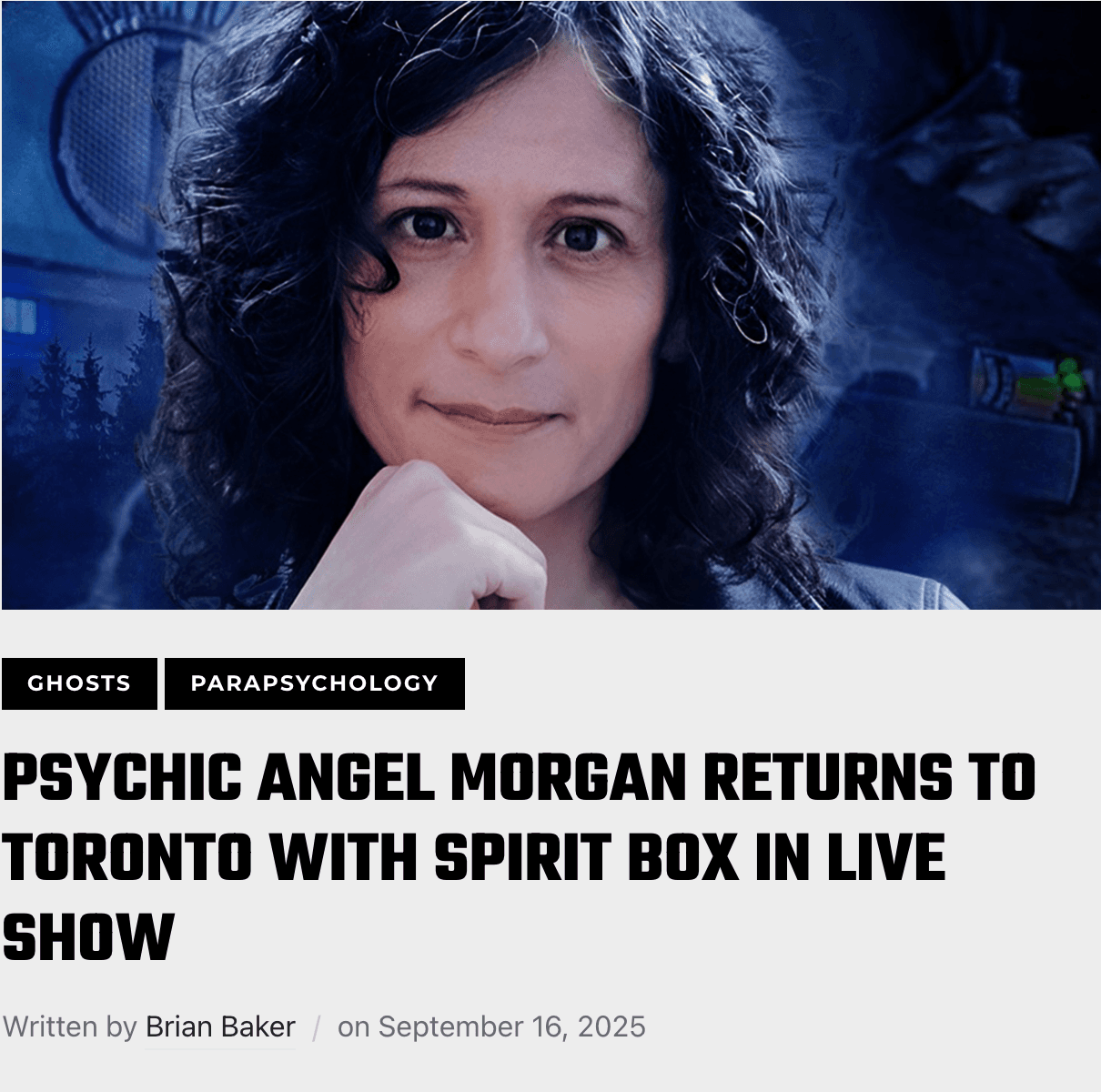 Angel Morgan on stage during a live psychic medium show, warm amber lighting.